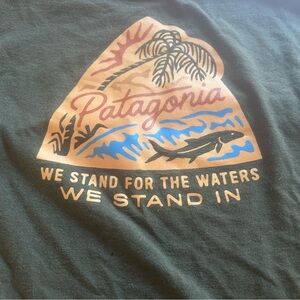 Patagonia Dark Green small tee “we stand for the waters we stand in”